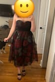 The model photo doesn't exemplify it so much, but in person, the poofy tool and red/black gives very much 1980s punk glam. Not my fave. - Hannah B.