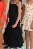 This dress was super cute for my tween. I was able to shorten the dress easily for my girl. She loved it! It fit her nicely and was really well made. - Mona M.