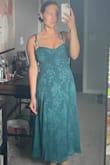 This dress is super flattering, especially for my height. I was worried about how it would fit in the chest, but it fits well and feels secure. The straps are thin, so keep that in mind if you are worried about the support. Honestly, this dress fits like a glove, would definitely buy again! - Taylor K.
