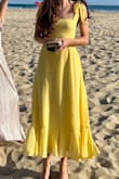 The dress is really lovely and the yellow color is vibrant. The only weird part is the straps where they seem to awkwardly dig in at the bust but are otherwise kind of long and not adjustable. I ended up just using fashion tape to keep them from falling down. Would have been 5 stars if the straps were adjustable. - Mary R.