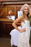 Very pretty dress, I bought it for my bridal shower. I had originally ordered a medium and thought I could get away with a small but when I tried the small on it was a lot shorter than the medium, making me go with the medium even tho it was a little bit too big. - Briana K.