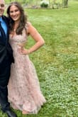 I wore this dress this past weekend to a wedding as a guest, and I've never gotten so many compliments! The waist has no stretch and zippers up, but a medium fit me perfectly. The straps are adjustable, and you can tie the back as loose or tight as you need to, which is nice. The only con is it was a bit long, even with heels, so I did have to keep picking it up when I walked, so I didn't get it dirty/step on it. Overall, one of my favorite dresses I've owned! So beautiful and feminine. I felt like a princess wearing it! - Hayley C.