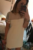 I ordered this dress for my engagement party! And i can't wait to wear it! I read some previous reviews and someone had said they ordered a bigger size because the arms were a little tight. So i ordered a large instead of a medium and it fits great. - Erika W.