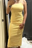 I am planning on wearing this dress to a wedding as a bridesmaid. The open back is stunning! The color in the photos is a little lighter than the actual dress, it is less of a sunshine yellow and more of a gold yellow. - Bella M.