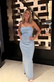 This dress fit like a glove. I was worried about the strapless but it never budged all night. It was a bit scratchy but worth it for the sparkle. - Mary K.