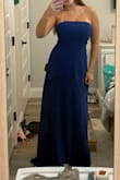 The dress is exactly how it's pictured on the model and it's very comfy. It's quite long and I'm 5'6 so keep that in consideration. I have a larger bust compared to my smaller frame and the soft lining of the dress makes the top of it slip down. For larger chests, the top feels a little unnatural but it works for what I need it for (sorority bid day). - Lauren K.