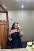 The dress is heavy! I had to pull it up every now and then throughout the night but it wasn't bad. It was a little big on me, but it's not stretchy so it was a good idea to size up! - Brittney H.
