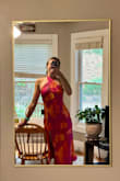 I really wanted to love this dress. It was absolutely stunning. The material and color was perfect for the upcoming summer wedding I am attending, and I loved open back. 

I sized down (normally a medium, ordered a small). The chest, waist, and hips fit very nicely. The material does not stretch.

My biggest concern was that the halter top was a bit tight on my neck because I'm so tall. I was planning to use tape to keep the  neck line closed and secure. 

The other issue was the thigh slit was fairly revealing especially when I hiked up the halter top to relieve the stress on my neck. A little more sexy than I was going for.

Very sad to send this gorgeous dress back. Would recommend to most folks but tall girlies beware! - Anna R.