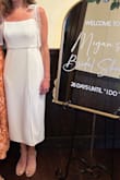 Love this dress!! I originally ordered an XS to wear to my wedding shower and wedding rehearsal. 

I'm typically an XS, but the dress was a bit snug in the bust and chest, so I exchanged for a Small, which fit true to size with just enough wiggle room for comfort. 

The bow straps are such a fun touch and allow you to adjust the dress length as you wish. 
I got so many compliments on it and can't wait to wear it again for the rehearsal.

Definitely recommend for any Bride-to-be! - Megan F.