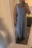 Pretty color, nice fabric, but the cut makes no sense. To start, the "tie shoulders" is just a bow - it's not functional so you can't adjust the straps. The straps themselves aren't proportionate to the rest of the dress - everything else fits perfectly, but the straps are so long they won't stay up. They're also too widely set (and I have broad shoulders, so that's saying something). Even after getting the dress tailored, the straps won't stay up. If I had the luxury of time and could return, I definitely would have. - Katie S.