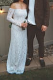 Bought this dress for our backyard wedding. First time I tried it on, I took it right off. The lace along the top is very cheap and doesn't match the colour of the dress and does a little flopping action. The night before my wedding day, I tried it on for the second time, and I loved how the sleeves looked but couldn't get over the top lace. My husband and I ended up staying up till 2am taking off the lace applique, and it was soooo worth it. Plus, it gave my arms so much more movement. It was the dress I pictured being in, and just like that, it was my wedding dress. If you have the patience I would suggest sitting down with a seam ripper and trying this diy project. It was a little loose on me, but it worked-would've been a little more flattering if it were a tiny bit smaller. Pictured was me not wearing my heels, so it was a little long - Ola M.