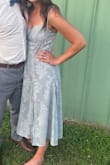 The dress was very nice quality, not see-through at all. Loved the straps, gave it an elegant look. Wore for my sister in laws wedding and got lots of compliments - Sydney L.