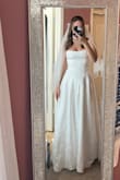 I bought this dress for my courthouse elopement, and it was absolutely perfect! It's very flattering, beautifully made, and the material feels high quality. I felt confident and comfortable all day. Highly recommend! - Iris P.