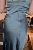 There was another girl who posted about how the backside of the dress had a weird puckering with the stitching, I should have listened to her as I had the same issue. My boyfriend thought my underwear was peaking through, so if my boyfriend can notice the weird stitching thats a problem. It looks a bit more dramatic in person than in this picture. I also own another satin dress that feels so much nicer and fits nicer than this one so maybe I am biased, but the material looked and felt cheap to me. I understand it is cheap lol, but I don't want it to easily appear that way. Also I ordered a small, I am 5'3, 125 pounds, 27 inch waist and it was a bit loose on top, so consider sizing down if you do buy this dress - Brittany B.