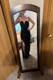 This dress is ABSOLUTELY gorgeous, and fits true to size. It has some stretch but it's minimal. I was able to find the perfect strapless bra from VS that works well with the low cut front. I feel downright gorgeous and sexy while wearing this. Granted, I've only tried it on - my event isn't until November 2025. But I know this dress will turn heads when I go out with my boyfriend.

The pictures I'm posting are not from the event, but from me just trying it on. I LOVE this dress. The slit is perfect - just enough to be sexy but not high enough to be slutty. - Whitney H.