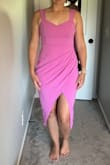 This dress is so stretchy, and form flattering. It accentuates the hips/waist in the best way. The draping over the tummy also provides coverage. Love that you can wear a regular bra as well. The slit is a little high, but the crossover fabric does the job to keep things covered. - Lindsey K.