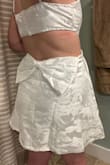 I'm a tall girl with curves, so it's always challenging to find a dress that is not too short or long on me (5'9, 46" hips, 33" waist, 36C chest). I should have ordered a Large instead of XL, but this dress is adjustable like a bra in the chest and VERY forgiving in the hip area, so I'm keeping it. Absolutely LOVE it - the bow on the back is adorable. It's perfect for our dinner party! - Morgan M.