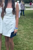 I bought this for my daughter's middle school graduation, and wanted something that wasn't inappropriately short for a teenager. 

For reference, I don't think her measurements quite align, but we purchased a small because she wears a size 4. 

The flare and extra room in the skirt were perfect for her to wear a pair of biker shorts underneath. 

Overall, the dress fit perfectly, with the exception of the sleeves; she said they were a tad too long.

The material has a nice sheen to it, and floral embroidery, the cutout in the back is still modest, and the bow tie adds a layer of sweetness.  

There were no snags in any of the stitches, and very nice quality as a whole. 

This is my first time purchasing from Lulus, and although I think shipping charges for both delivery AND returns (for a refund) is a bit antiquated, this will probably be the first place I look the next time my daughter needs a dress. - Heather S.