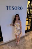 The colors of this dress are so pretty!! The length, style and fabric of this dress are all perfect. I didn't wear a bra with it because I could tie the back to a comfortable tightness. This was a great summer vacation dress!! Love adjustable straps too. Will be wearing it again. Ordered a medium and it was perfect! - Melissa H.