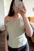 I absolutely love the top! The color is chefs kiss but also it shows my back tattoo perfectly! - Marwa N.
