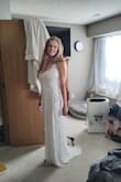 It's a great quality dress, has a good weight to it. The straps were too long/the bust sat a little lower than I'm used to. I am getting those tailored and cups added, so not a biggie. I'm very happy with the bright white color and all the details. I'm wearing it to our courthouse wedding with my cowgirl boots! Would recommend! - Logann W.
