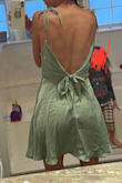 Ok I love a lot about this dress. And I am keeping it, but it is shorter than I thought it would be bc the model is 5 inches taller than me, but maybe my butt is bigger because it seems to be resting at the same part. I need to steam it and adjust the tie straps and get the static released bc it's clinging but it's really special and I love a lot about it. Heads up, the material is very very thin, so depending on what your plan is for stick on boobs etc, you might need to make sure they're not a different tone or you'll see them. - Alicia N.