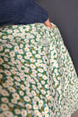 I love the dress; it fit nicely with a XS size. The S had to be returned. The hem on this dress is not that strong though. I wore this dress literally 3 -4 times and it ripped. Had to spend some extra money trying to get it fix and the dress itself wasn't cheap either. - Lisa M.