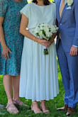 I wore this for my summer civil ceremony. It was beautiful and felt cool. The skirt has lovely flow and pockets, and the top accommodated my broad shoulders. I wore the top tucked into the skirt (short torso), and everyone thought it was a one-piece dress, but I'm so glad now I can wear each piece with different outfits. Only feedback is the pockets do show through the skirt a little bit, and it does need a good steam. - Maya C.