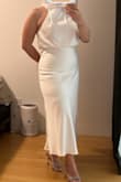 Absolutely amazing! This dress exceeded my expectations in every way. It fits true to size and has a flattering cut that makes you feel confident and comfortable. The fabric is high-quality and feels soft and smooth against the skin. I also love that it's double-layered, so there's no worry about it being see-through. It's incredibly comfortable to wear for hours, and the overall look is both elegant and effortless. - Eda C.