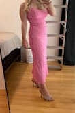 This dress is a total showstopper! The pink color is gorgeous and the fit is absolutely perfect, it hugs all the right places without feeling tight. It strikes the perfect balance between cute and sexy, making it ideal for everything from date night to a night out with friends. The fabric is high-quality and not see-through at all, which is always a plus. It feels great on the skin and moves beautifully. - Eda C.