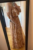 Absolutely love this dress; it's going to look so good in my engagement shoot! It does run a little large and is stretchy at the waist but it still fits well and holds its shape nicely. The sleeves are so cute too! - Grace K.