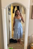 Love this dress, it definitely runs a little on the small size so if you are usually between sizes I would size up. Otherwise this dress is so cute and high quality. - Belle H.