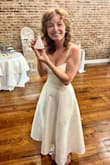 I wore this beautiful dress for my bridal shower. This dress is absolutely stunning and fits beautifully true to size with a flattering silhouette. The material feels high-quality, with an elegant, classy drape that moves with sophistication. I received so many compliments when I wore it! I styled it with statement earrings and heels to elevate the look even further. One of my favorite features? It has pockets, such a thoughtful and practical touch! It did arrive with a few wrinkles from shipping, but a quick press with an iron smoothed everything out perfectly. I highly recommend this dress; it's both timeless and versatile. - Alina K.