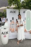 I purchased the dress for an all white party where elegance is the standard. The copy paper white color was perfect, and the material [was] so soft and comfortable. The A line complemented my full figure body and small waist. The back is out, but not a halter, so I had to get creative with finding the right bra. I settled on a white lace bra with detachable straps. I used the clear straps, and fortunately, the bow tied over the band in the back.  It's now my favorite white dress and recommend it for any special occasion. - Stephanie S.