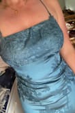 I ordered this for a formal wedding in an XS and a S, and the XS was the perfect fit in the waist and length-wise. It was highly discounted so I tried both sizes. The dress grazes the floor in heels, so if you are on the shorter side, keep that in mind. Unfortunately, the straps are so stretchy and loose, as other reviewers pointed out, and that led to the bust feeling saggy and unsupportive. This dress would be perfect if the straps were adjustable. I'm still hopeful that I might be able to shorten the straps and wear this because the fabric is a beautiful color and pattern. It's like a deep slate blue, and the floral pattern is really pretty. - Erin H.