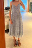 I fell in love with this dress when I first tried it on (the first pic). One of the straps broke, but my mom was able to fix it. I put it in my closet for future use, only to try it on again later and find that it was longer on one side (second attached pic) and also had bumps by the zipper. I'm so sad because it's such a pretty dress and nice length. - Siena P.