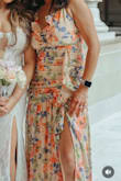 Perfect for a summer wedding, beautiful color that complements my brown skin. My chest was a little big for the dress, but it was a perfect size overall, and the ruffles helped around the chest area. Nice slit on the left for a great photo ppl. A little more on the conservative side, however, just the right amount of sexiness! - Cly T.