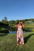 I got this dress for a friend's wedding, and it was a success. Everybody complimented the dress; it was super flattering. This lady told me her family had elected mine the most beautiful dress at the wedding. It fits great, I just had to buy some high heels because I'm 5.1 and it was very long for me, but it was perfect! - Paula D.
