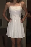 I plan on wearing this dress to my graduation, and it couldn't be cuter!! It has a wonderful fit at the top and is beautifully loose and flowy below the waist. The button up style and extra fabric on the top give it a unique touch to an otherwise simple style. Love it and will wear it lots!!! - Lara N.