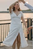 I bought this dress for our engagement photos. The dress is lined well, so nothing underneath shows through. It's lightweight and super comfortable (I was afraid the puffy sleeves would be itchy, but they weren't at all). I honestly probably could have ordered a Small, as there was a tiny bit of gap in the back, but this wasn't so loose that I was hanging out of the dress. - Kelsey G.