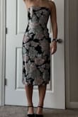 I personally know that I am a size XS in lulus dresses, so the dress fit very well when I got it! It's a little tight on me, but I did prefer it that way. I wore this for a rehearsal dinner and thought it was great. Definitely something new for my closet that I don't have anything like! I love the colors on the black one. - Anna G.