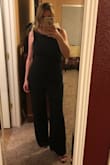 I bought this to wear during an upcoming vacation and thought a jumpsuit would be fun and edgy.  This piece caught my eye immediately with the open back and ruffle.  When it arrived I tried it on and was delighted to find the legs were long enough and the fit was easy, comfortable and true to size.  It can be challenging to find the right fit in all dimensions with a jumpsuit but this piece nails it in every area.  Very classy! - AMY O.