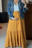 Got this for a beach family photoshoot that happened a bit before my bump came, so I was looking for something to be able to exaggerate it and be flowy. It is so comfy and was perfect for pics! I'm 5'3, so medium was a bit long, but I sized up to make sure it would fit the growing body. As others mentioned, it is a lot of material but not in a bad way! - Leigha B.
