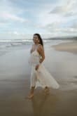 Loved this dress for my beach maternity shoot. I sized up for the bump, but I might have been able to get away with my normal size. Sheer and beautiful. - Claudia G.