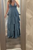 This dress is very comfortable. Loose true to pictures. The dress is long, so you may need to do some hemming at the bottom. - Katelyn G.