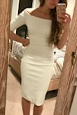This dress fits perfectly! It is very simple and classy. The off the shoulder neckline makes the dress look cuter. I can't wait to wear it to my bridal shower! - Lauren B.