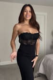 Needed a Medium to provide breast coverage, and the bodice uses plastic boning. It doesn't lie flat to the skin but bows outward. It costs more than the dress just to have it altered, very beautiful. Very cute dress overall. - Maxene H.