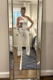 Wore this to a white party fundraiser and felt great in it. Many compliments. Length worked on my short frame because I was wearing 4" platform heels. - Dana (.