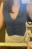 What a great top! Fits true to size, the detailing on the back is so cute! Check the photos - Camille S.