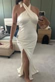 This is a beautiful ivory dress!! I looooved the fit- the cut is very flattering to an hourglass figure. The quality is great, nice thick fabric with lining, so no see-through issues! My only problem is that the zipper would not sit flat even when I tried pulling it down. If it wasn't for the zipper problem, this probably would've been my engagement party dress!! See pics about the zipper. Maybe I just got a faulty one - Karla T.
